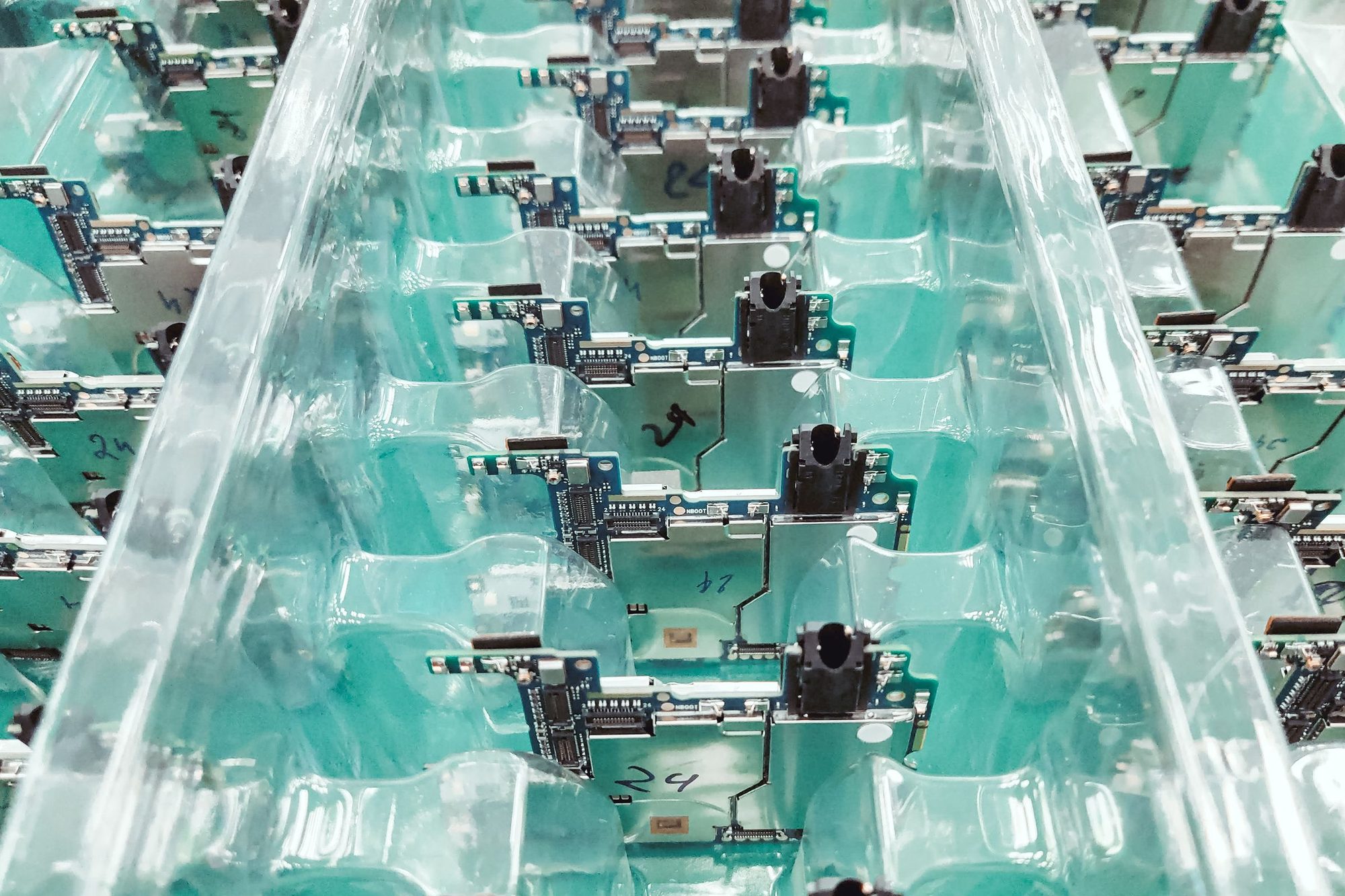 Circuit board modules seated in clear plastic shipping trays